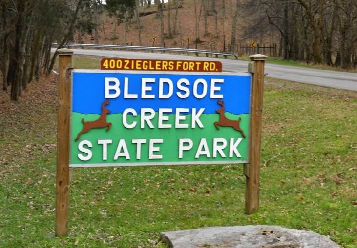 Bledsoe creek state park sign located within a serene state park.