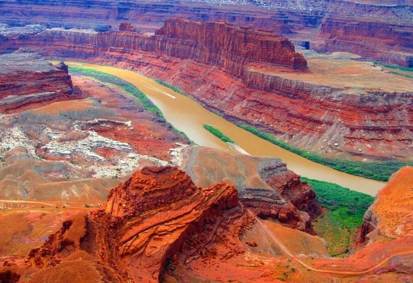 Dead Horse Point State Park 1 An aerial view of a stunning canyon with a meandering river, located within a State Park.