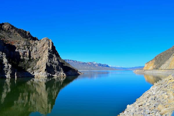 rock formations beside reservoir at buffalo bill state park in wyoming