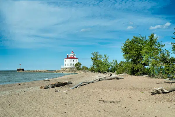 lighthouse on a beach in a state park near cleveland ohio