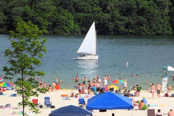 sailboat off public beach at claytor lake state park in virginia
