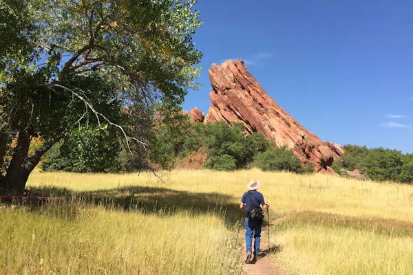 hiker approaching a rock formation in a colorado state park