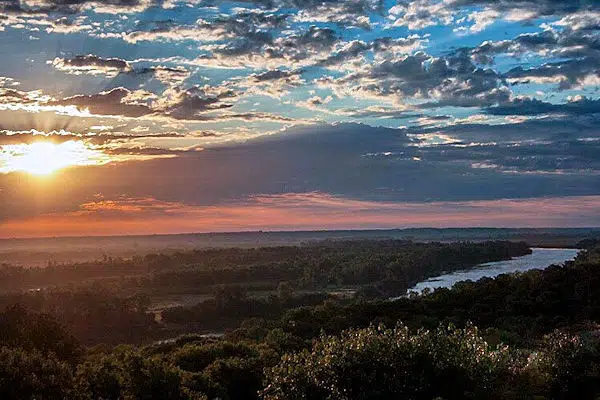 sun setting over the missouri river in a state park near lincoln nebraska