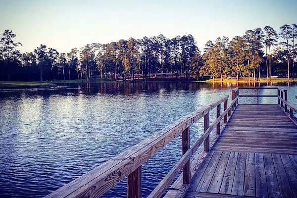 pier extending into a lake at a state park near gulfport mississippi