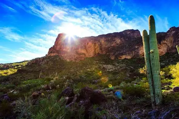 sun rising over a rock formation in a state park near phoenix arizona