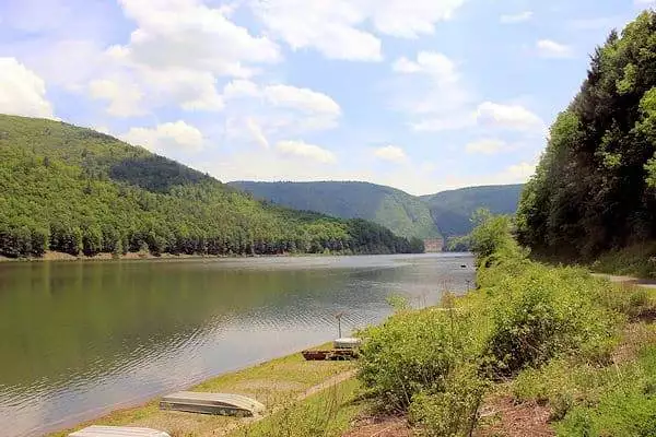 lake surrounded by rolling hills at a state park near altoona pennsylvania