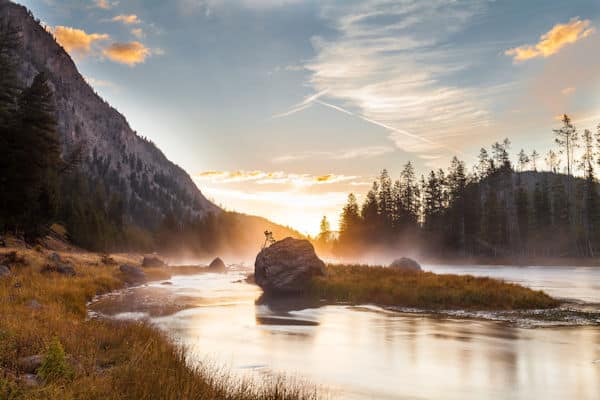smoke rising off the water at dawn in a state park near bozeman montana