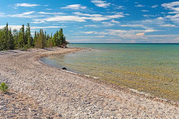 Thompson's Harbor State Park 97 A State Park beach on the shore of a lake greeting card by panoramic images.