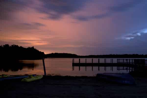 sunset over a lake in a state park near lansing michigan