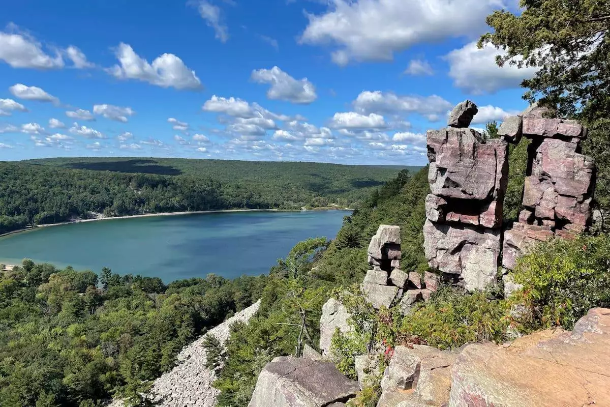 rock formation overlooking a lake in a state park near baraboo wisconson