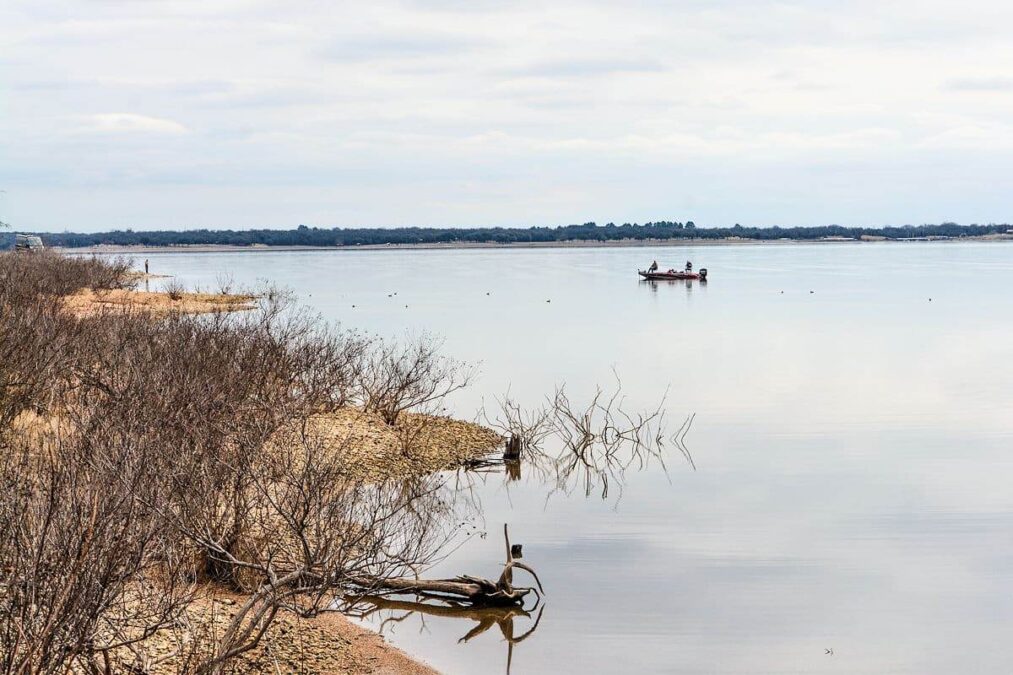 fishermen in a boat on a lake at a state park near longview texas