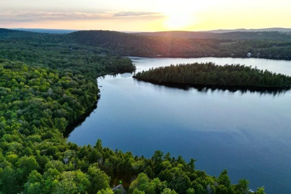A drone shot of St. George Lake in Liberty, Maine at Sunset.