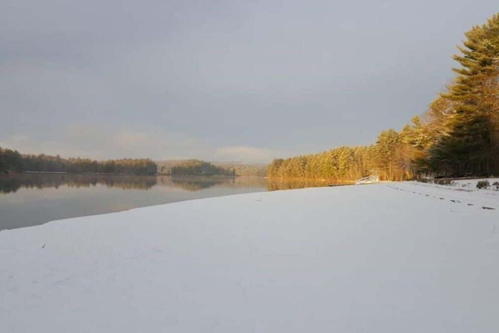 snow on the bank of the water at Range Pond State Park