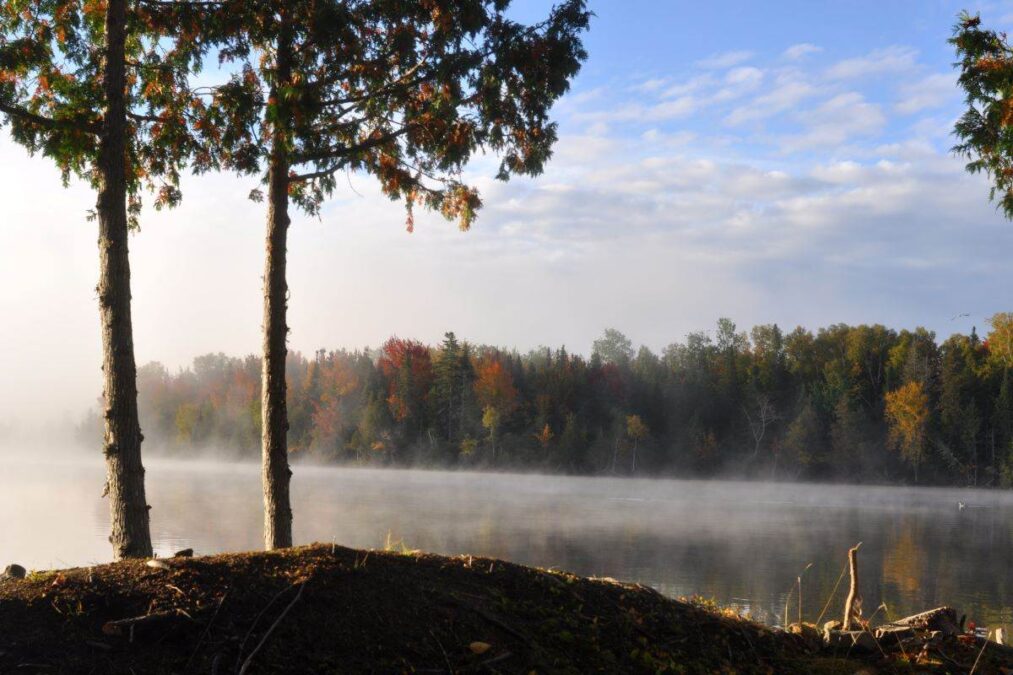 a view of fog over the water at Rangeley Lake State Park