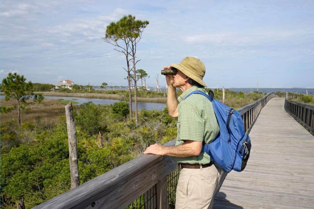 man birdwatching at a state park near mexico beach florida