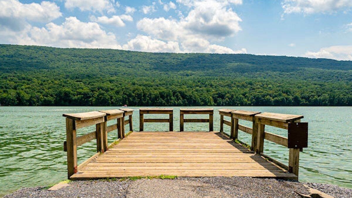 A dock looking out to the mountain and Foster Joseph Sayers Reservoir at the Bald Eagle State Park in Pennsylvania.