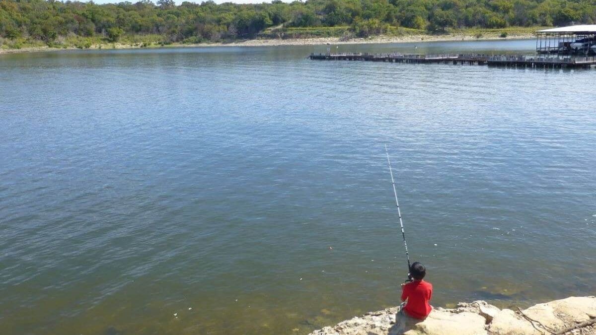 Boy fishing in Lake Texoma at Eisenhower State Park in Texas