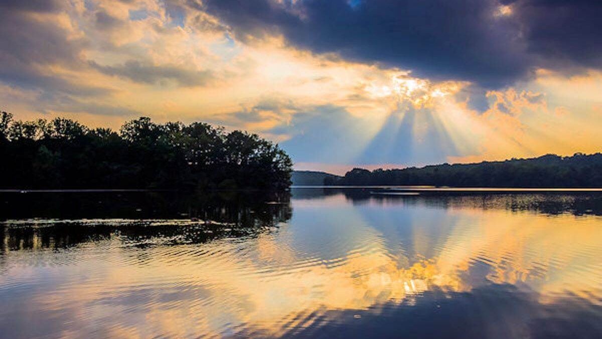 the clouds reflect off of Pinchot Lake at Gifford Pinchot State Park