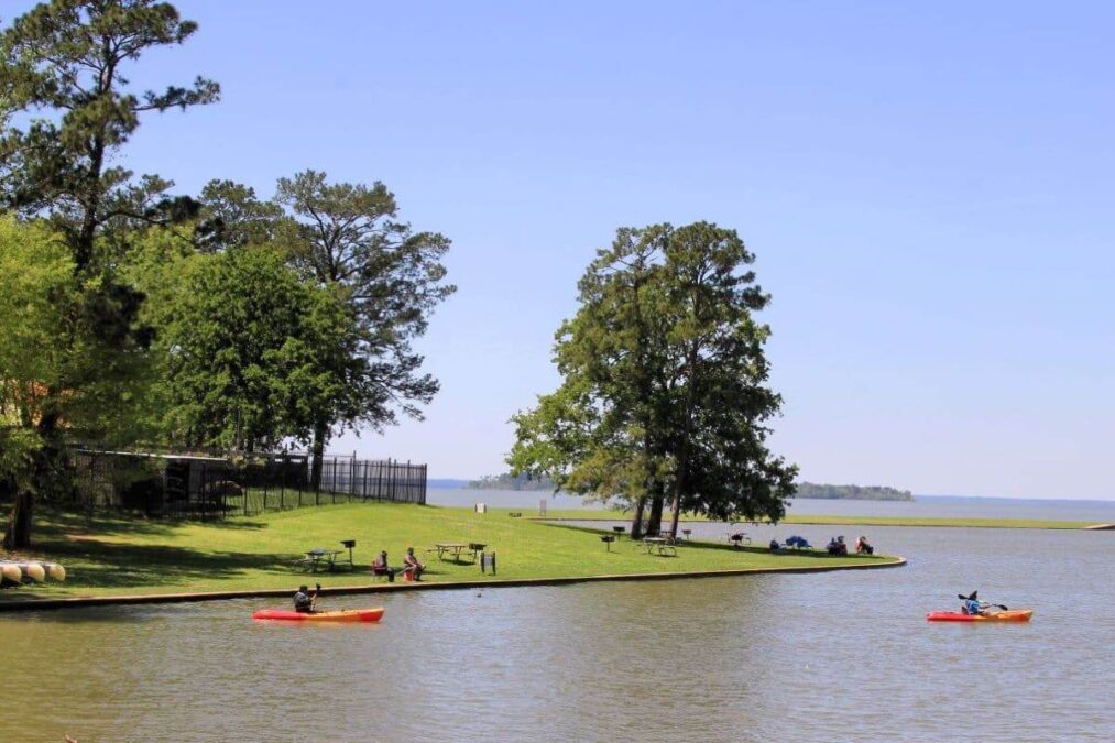 people kayaking on the water at Lake Livingston State Park