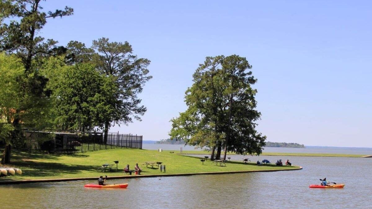 people kayaking on the water at Lake Livingston State Park