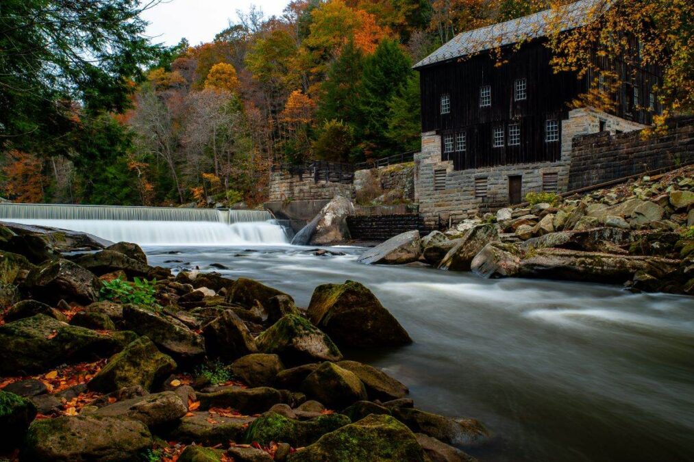 Rustic Mill Adjacent to Rushing Stream in Peak Autumn Season in McConnells Mill State Park