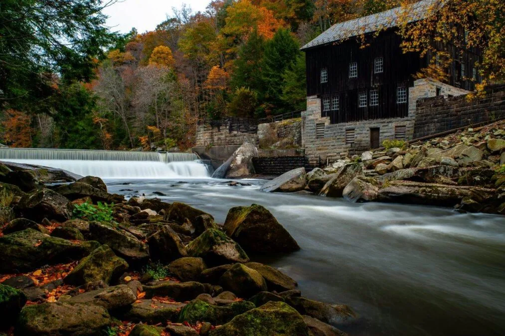 Rustic Mill Adjacent to Rushing Stream in Peak Autumn Season in McConnells Mill State Park