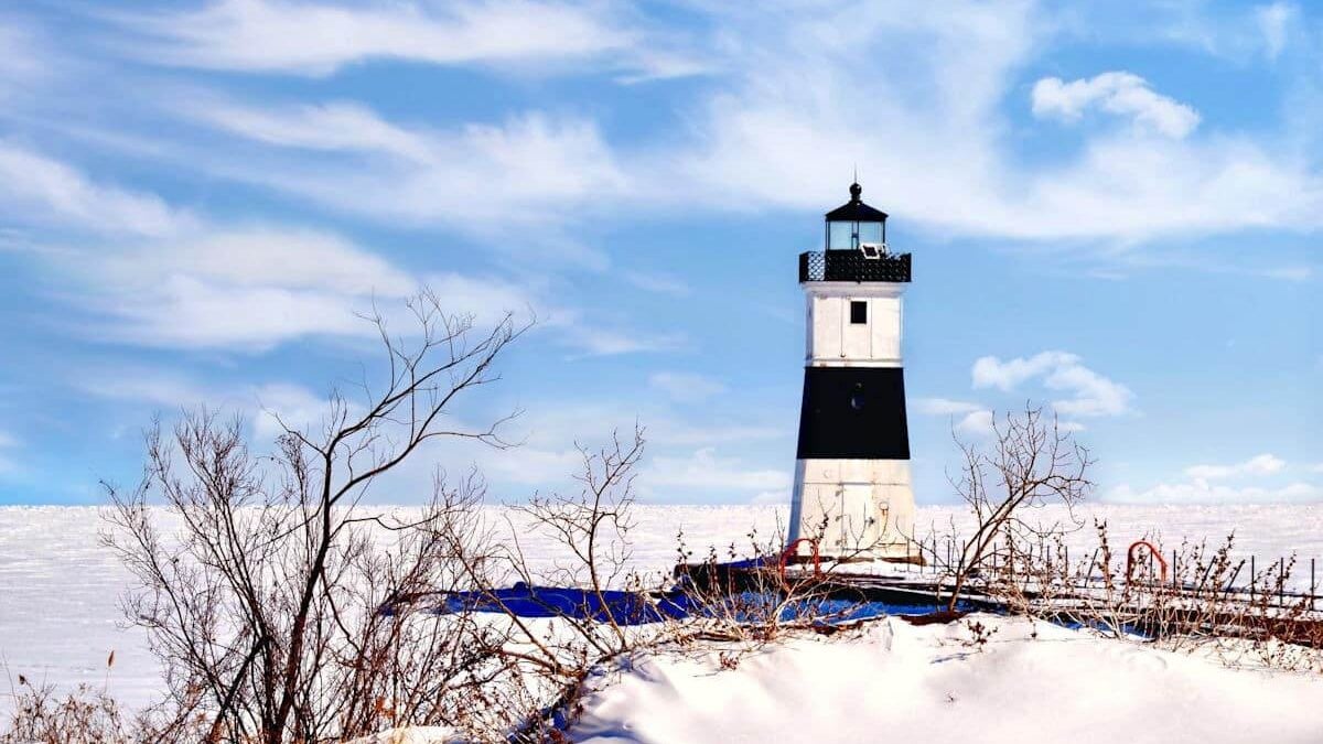 A lighthouse amongst the snow at Presque Isle State Park