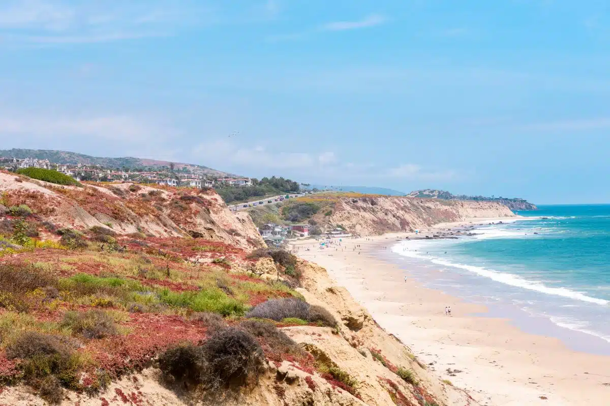 view of the beach from the cliff above Crystal Cove State Park
