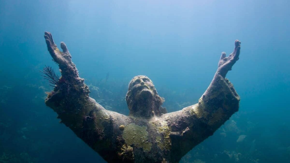 Religious underwater statue encrusted in corals at John Pennekamp Coral Reef State Park