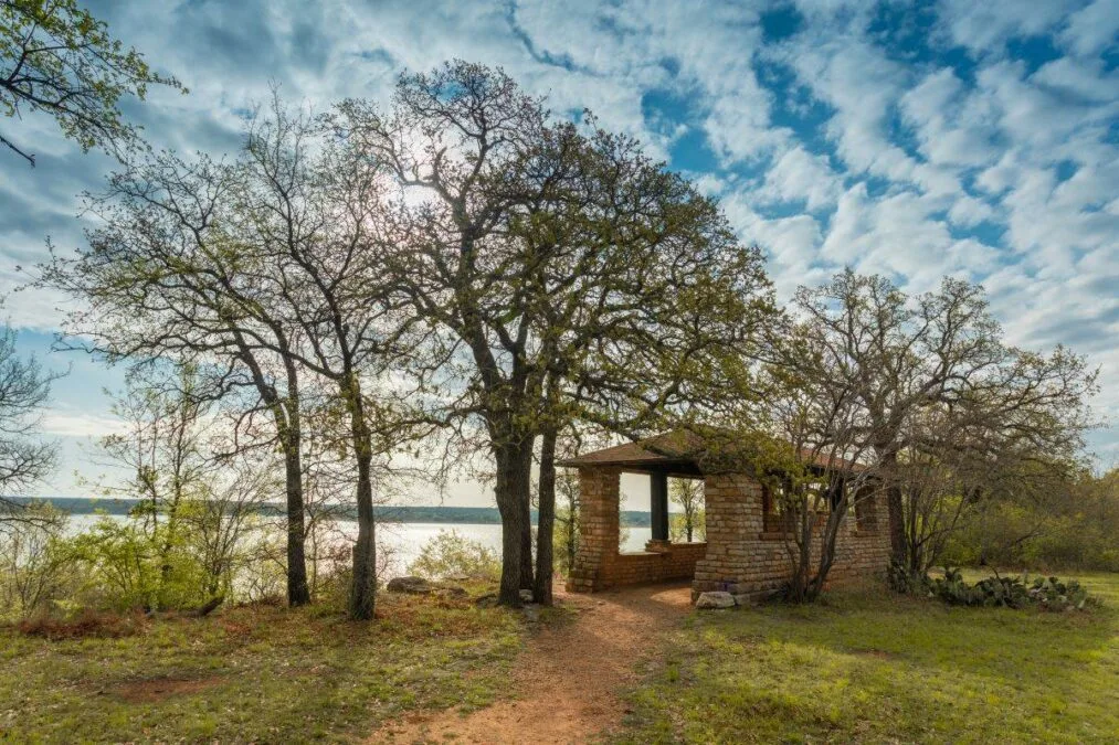 Stone pavilion by the water at Lake Brownwood State Park