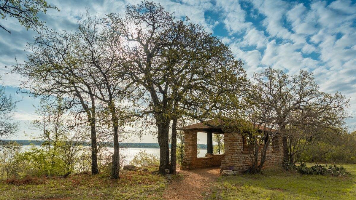 Stone pavilion by the water at Lake Brownwood State Park