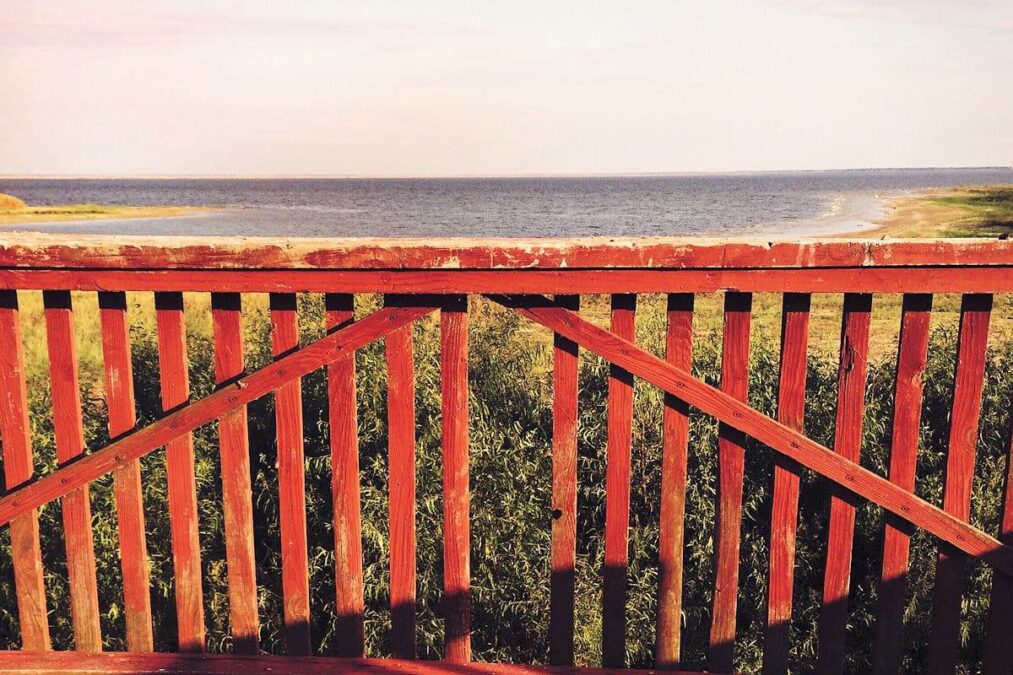 Red wood fence on the edge of Lake Tawakoni