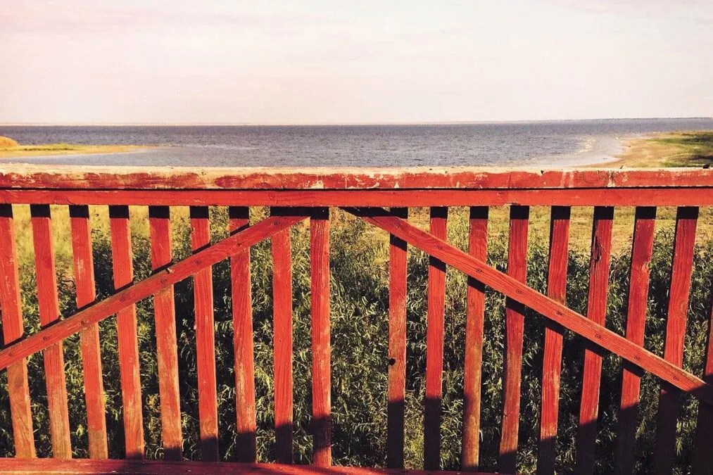 Red wood fence on the edge of Lake Tawakoni