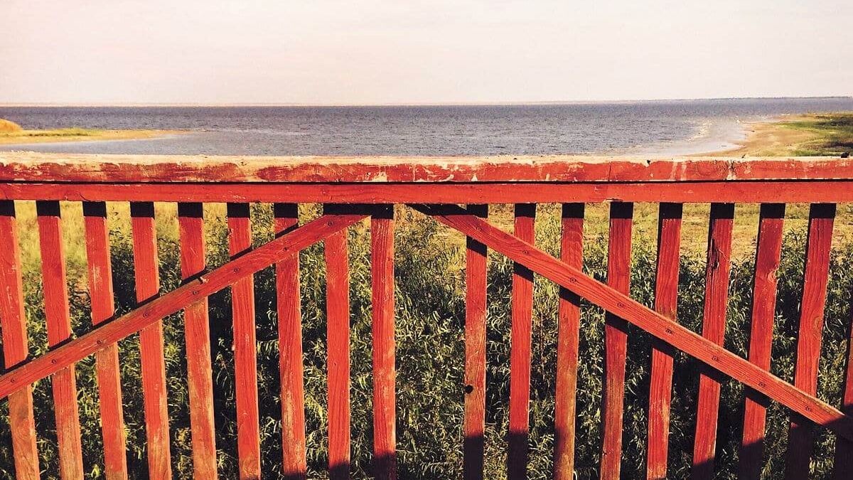Red wood fence on the edge of Lake Tawakoni