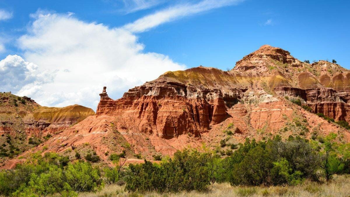 hills rise above the trees at Palo Duro Canyon State Park