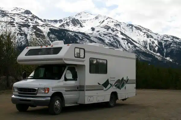 class C motorhome parked at a state park with mountains in the distance