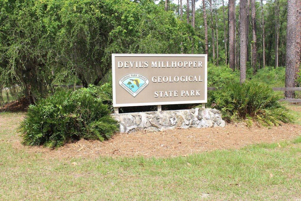 park sign for Devil's Millhopper Geological State Park