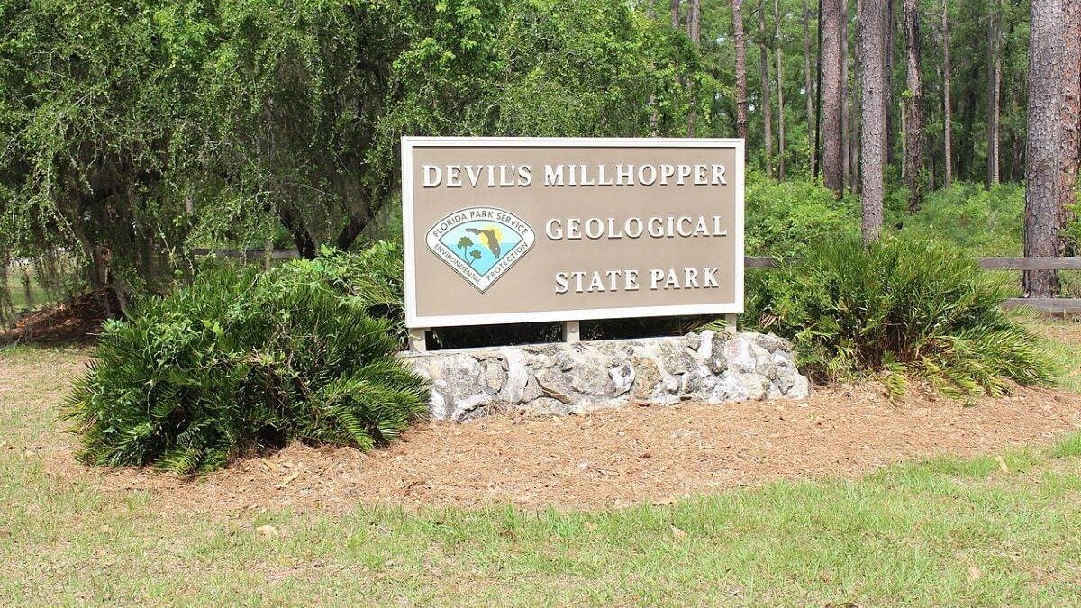park sign for Devil's Millhopper Geological State Park