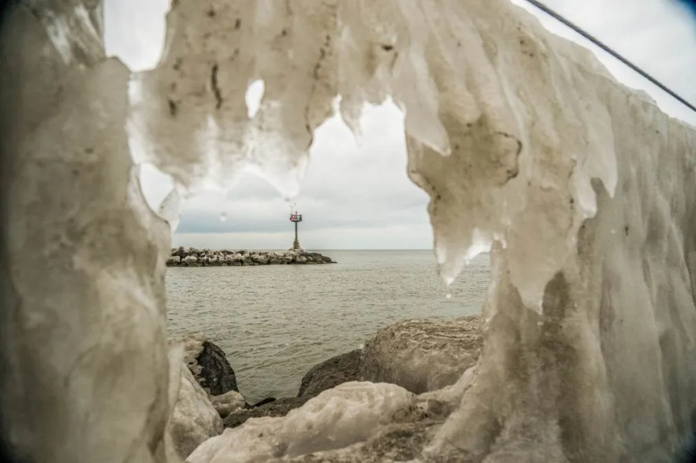 Geneva State Park 22 Jetty through a hole in the ice at Geneva State Park