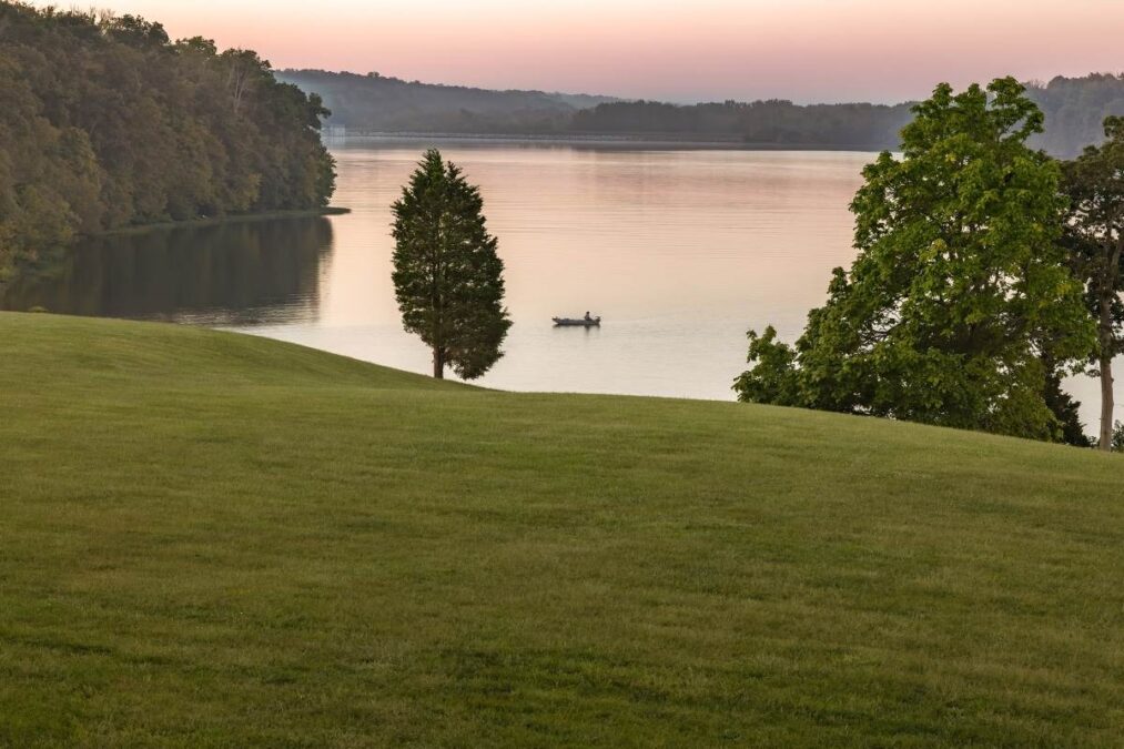 boat on the water at Hueston Woods State Park at sunset