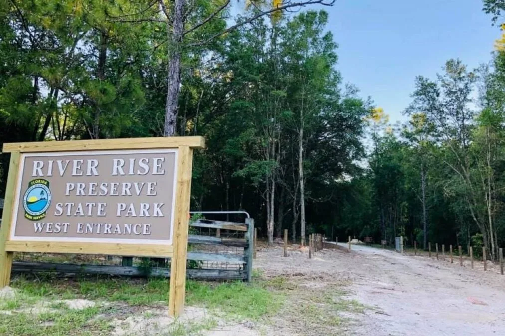 Park sign for west entrance at River Rise Preserve State Park