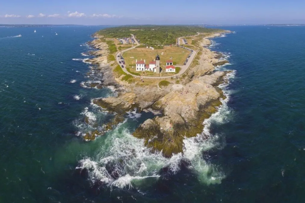 An aerial view of a lighthouse on an island located in a State Park.