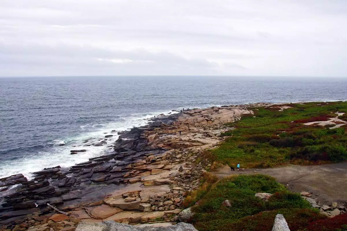 waves crash against the rocky coast at Halibut Point State Park