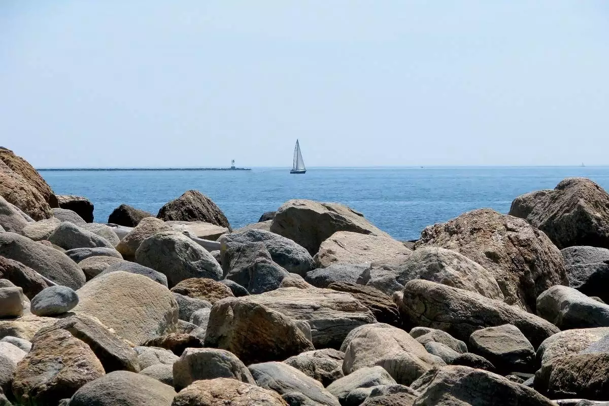 Hammonasset Beach State Park 3 sail boat off the rocky coast at Hammonasset Beach State Park