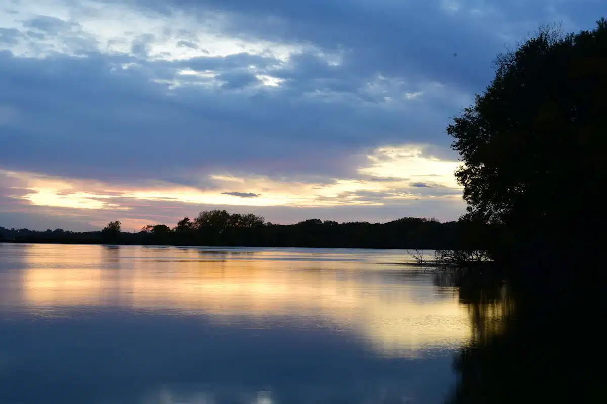 sunset over the lake at a state park near rochester mn