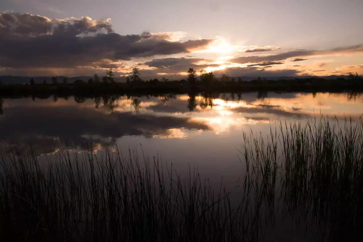summertime sunset over the water at a state park near cheyenne wy