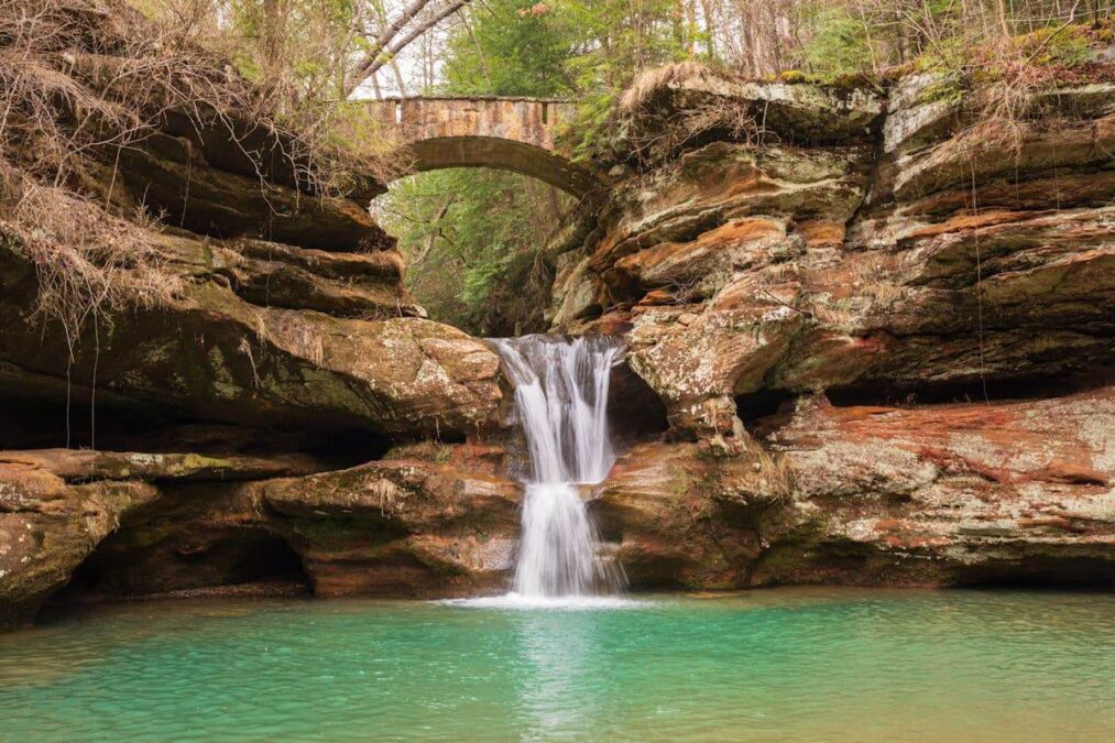 stone bridge over a waterfall in a state park near columbus ohio
