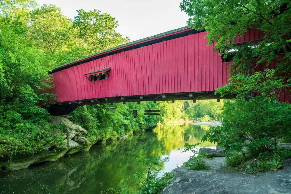 red covered bridge spanning sugar creek at Turkey Run State Park
