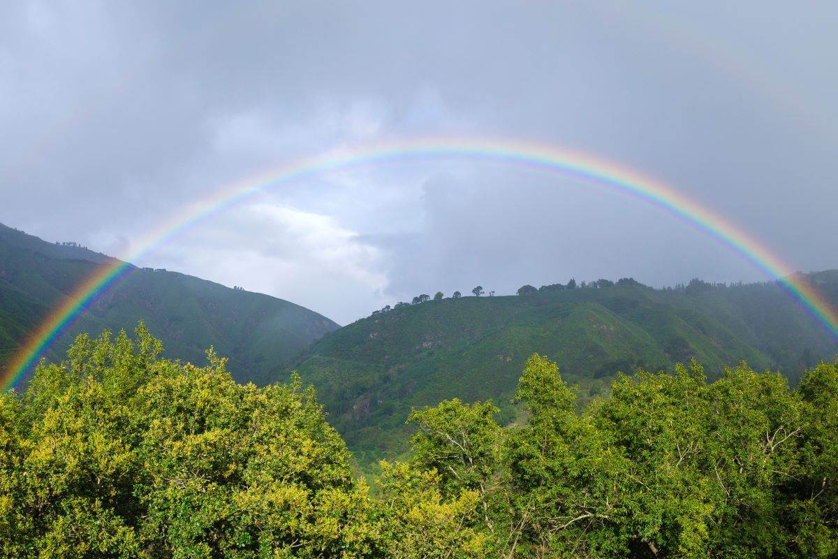 Rainbow above the hills at Andrew Molera State Park