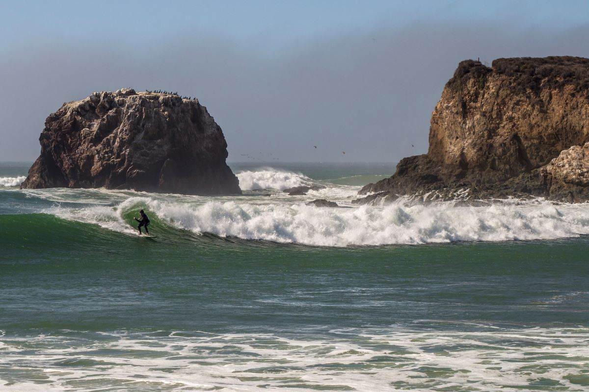 person surfing at Andrew Molera State Park